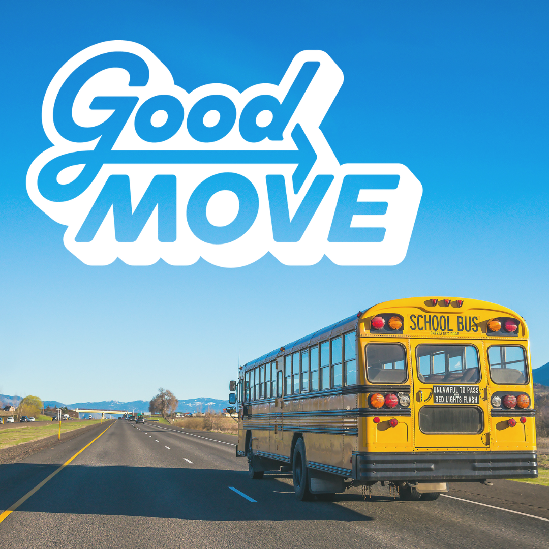 Photograph of a school bus on a two lane highway with the Good Move logo in the upper left corner.